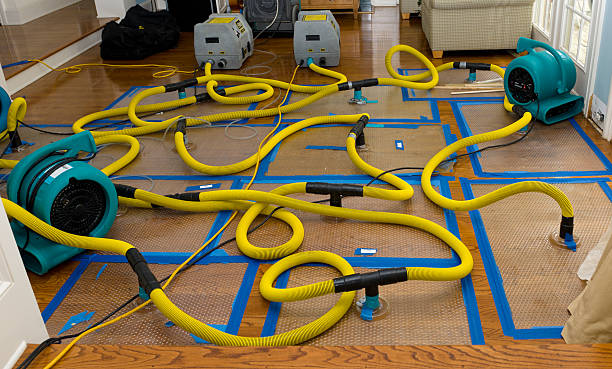 Professional Flood Damage Restoration technician working in Stockport, OH